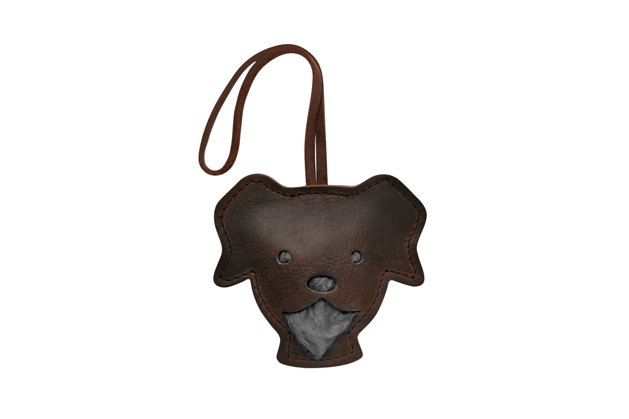 Handgefertigter Leder-Tütchenspender "Theo" in Form eines Hundekopfes, gefüllt mit schwarzen Kotbeuteln.