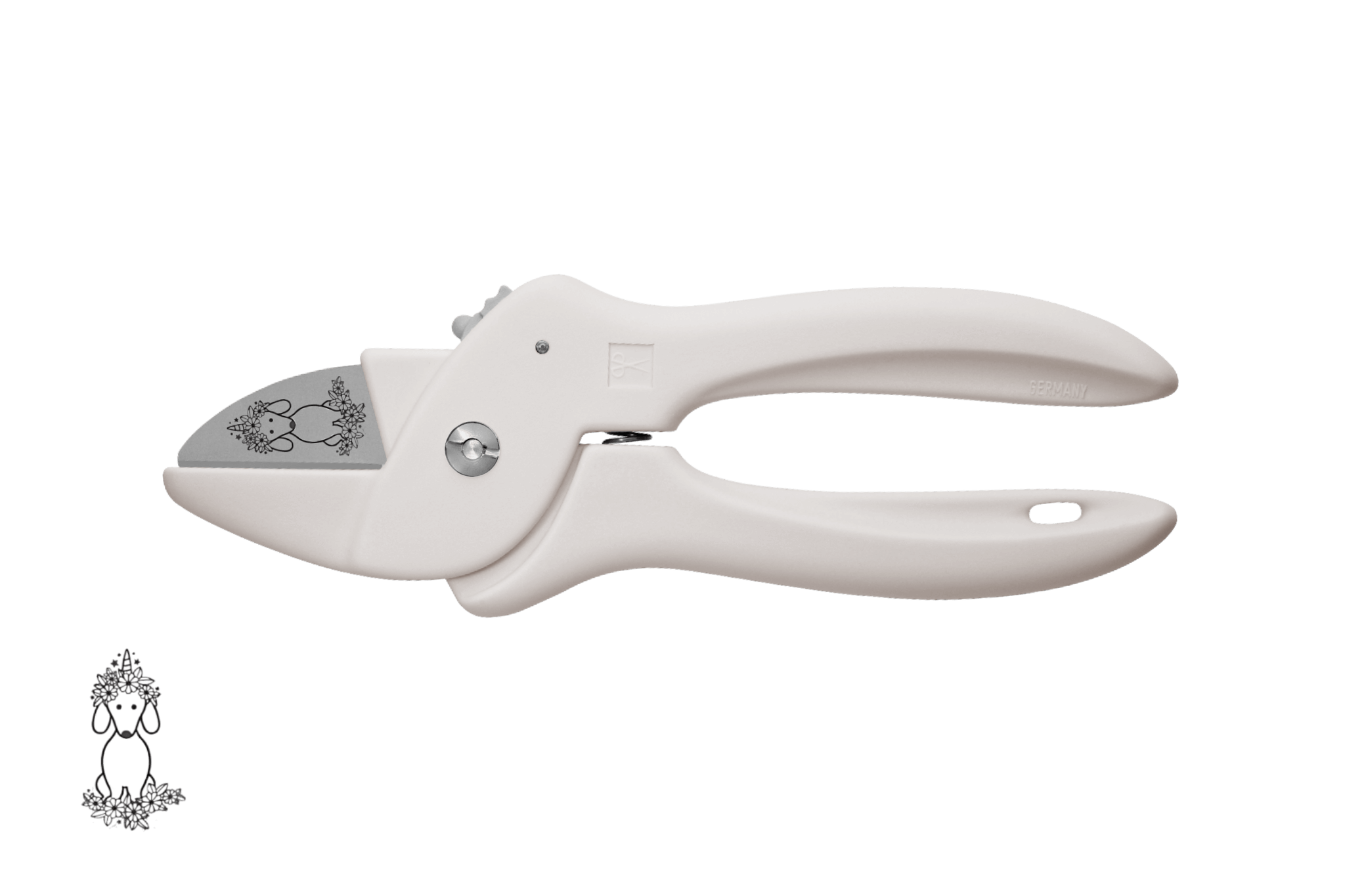 Greta's Dackel-Blumenschere von PAUL in Pastellbeige, veredelt mit einer detailreichen Dackel-Einhorn-Gravur.
