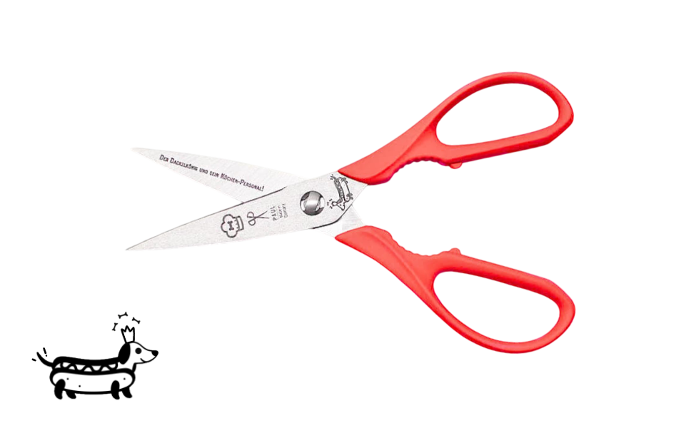 Greta's Dackel-Küchenschere von PAUL in Neonrot mit Aushebefunktion und Gravur "Der Dackelkönig und sein Küchen-Personal!".
