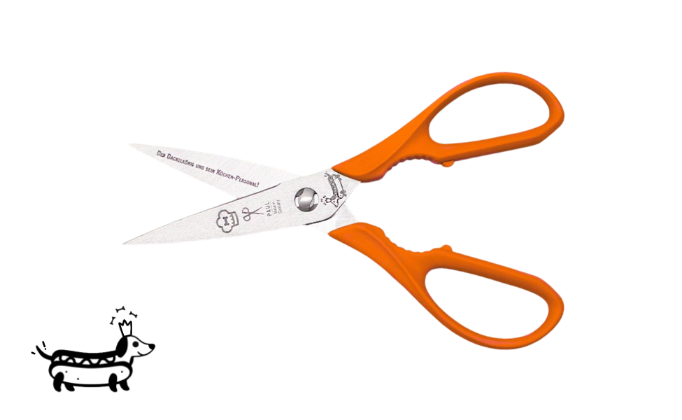 Greta's Dackel-Küchenschere von PAUL in Orange mit Aushebefunktion und Gravur "Der Dackelkönig und sein Küchen-Personal!".
