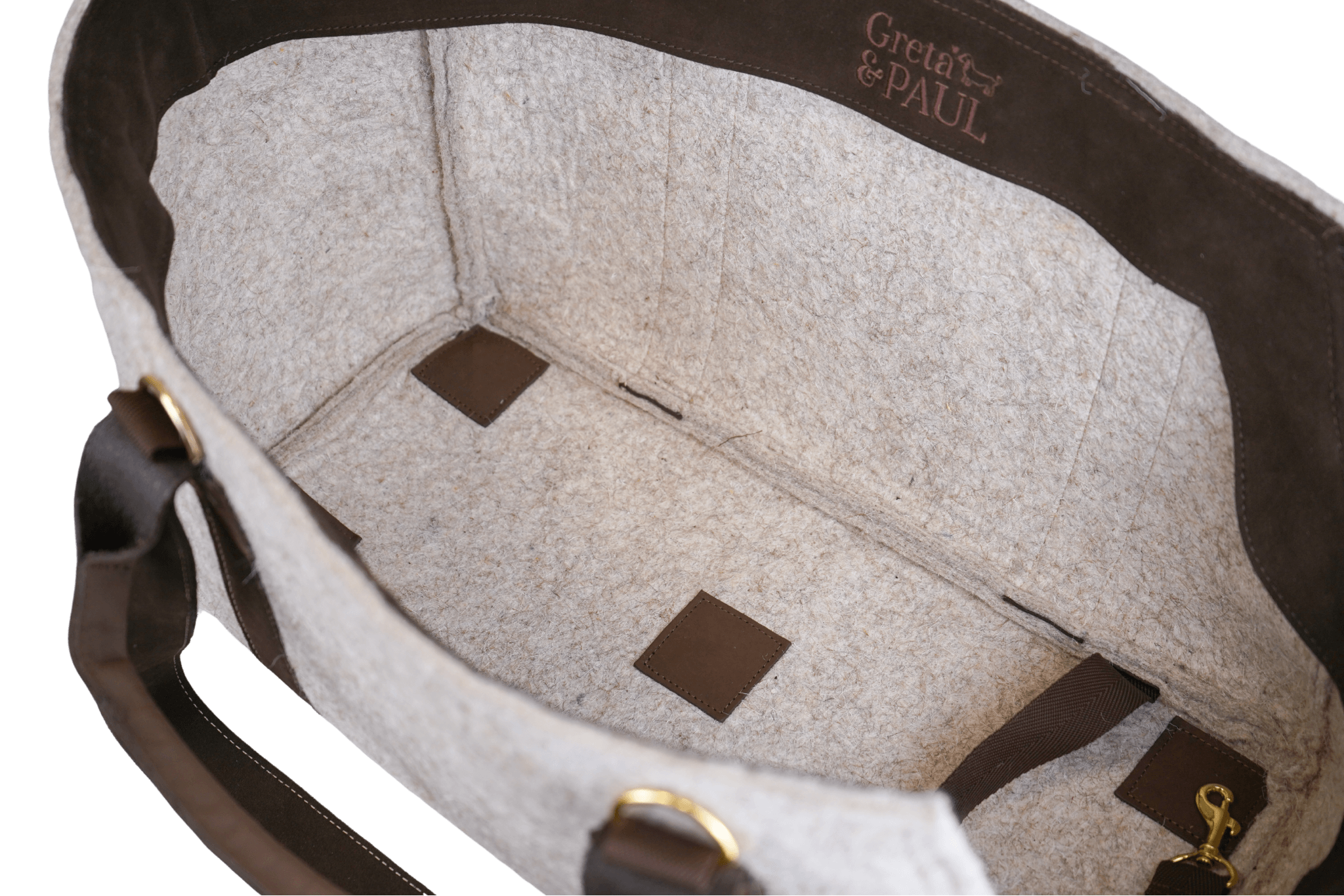 Innenansicht der Greta's Luxus-Lodentasche mit gesticktem Greta & PAUL Logo und hochwertigen Lederdetails.
