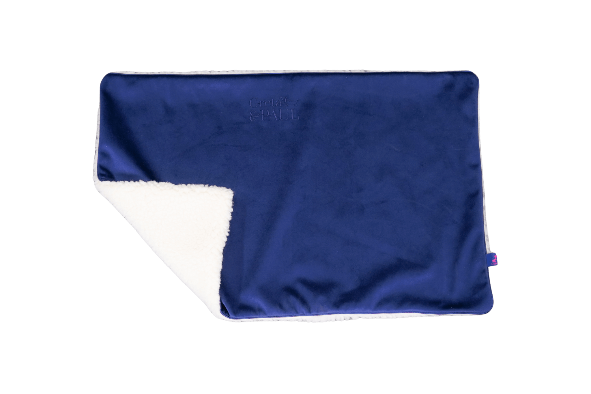 Premium-Hundedecke von Greta & PAUL in Königsblau, die umgeschlagene Ecke zeigt das kuschelige, weiße Teddyfutter.

