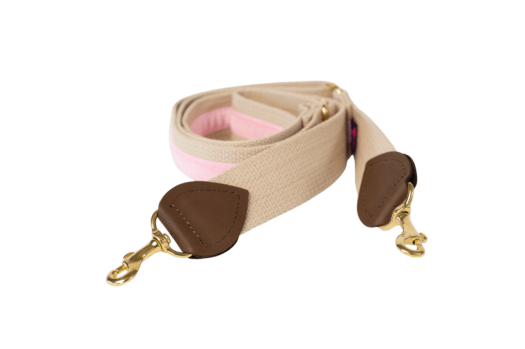 Schulterriemen in Beige mit rosafarbenem Samtstreifen für Greta's Hundetasche, mit Lederdetails und goldenen Karabinern.