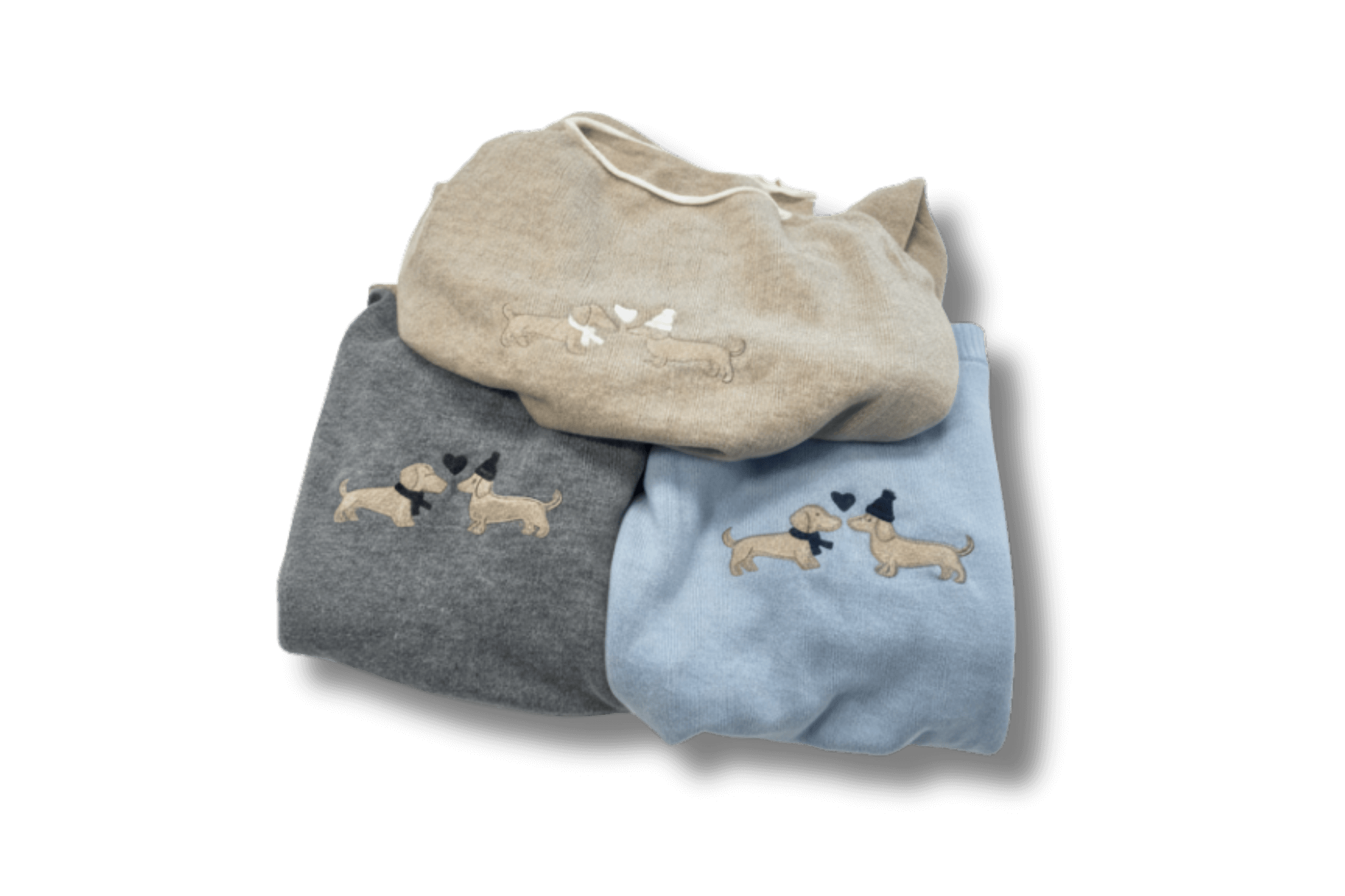 Drei zusammengelegte Gretas Dackelpullover in Grau, Beige und Hellblau