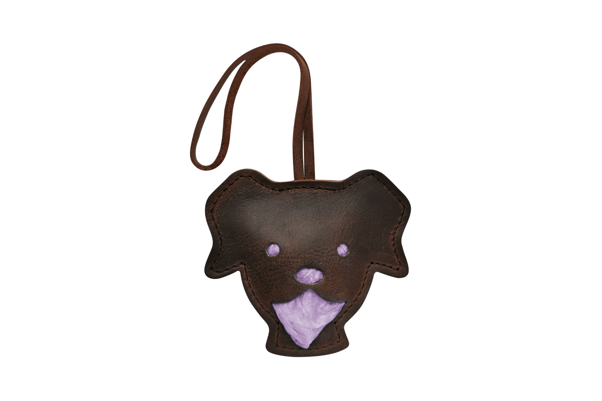 Handgefertigter Leder-Tütchenspender 'Theo' in Form eines Hundekopfes, gefüllt mit lilafarbenen Kotbeuteln.
