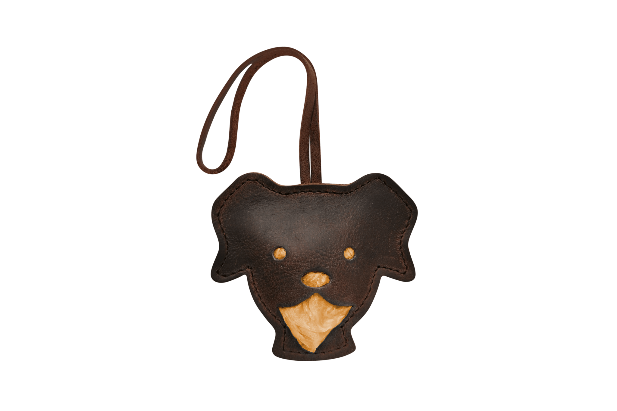 Handgefertigter Leder-Tütchenspender 'Theo' in Form eines Hundekopfes, gefüllt mit orangenen Kotbeuteln.
