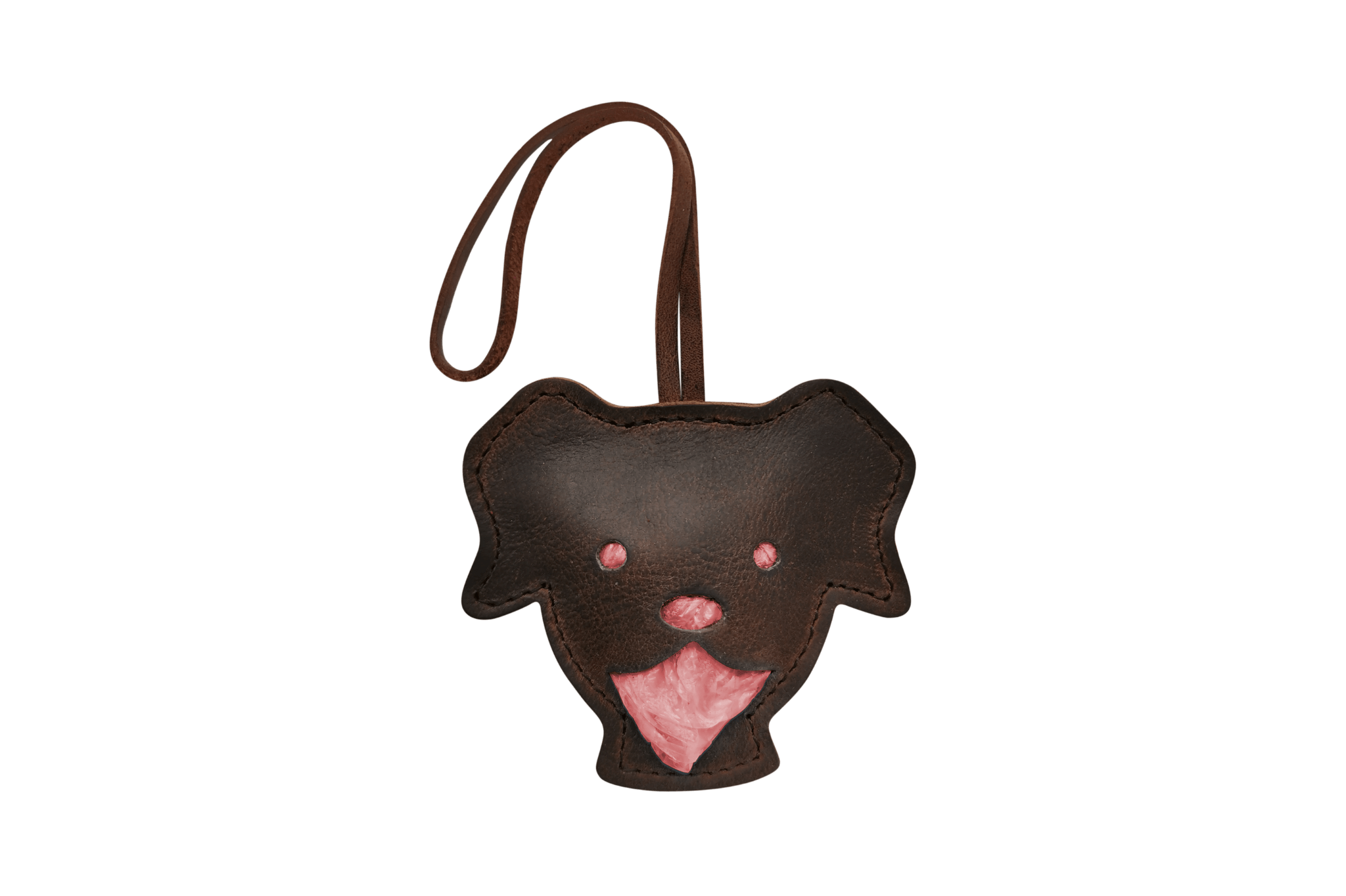 Handgefertigter Leder-Tütchenspender "Theo" in Form eines Hundekopfes, gefüllt mit roten Kotbeuteln.
